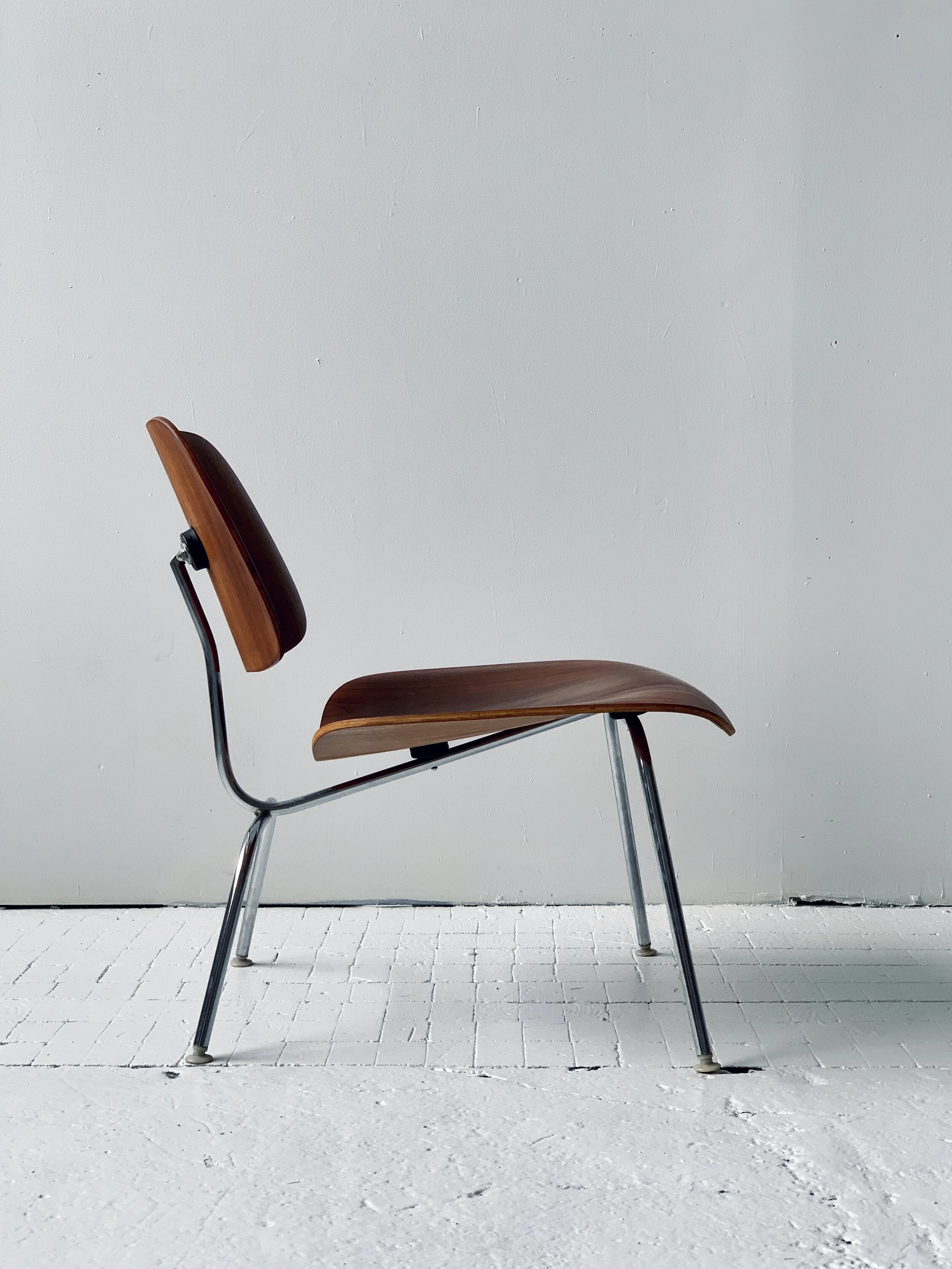Vintage Eames Molded Plywood + Chrome LCM Chair, produced by